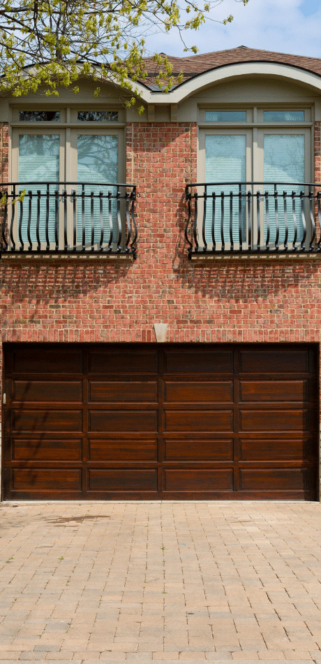 Oak wood duplex garage door on a Newport home
