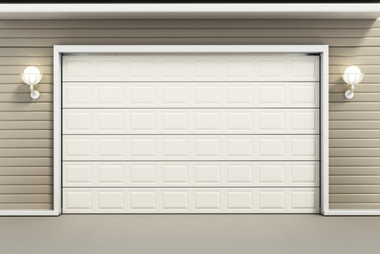Cream sectional garage door on a house with vinyl siding, flanked by wall lanterns
