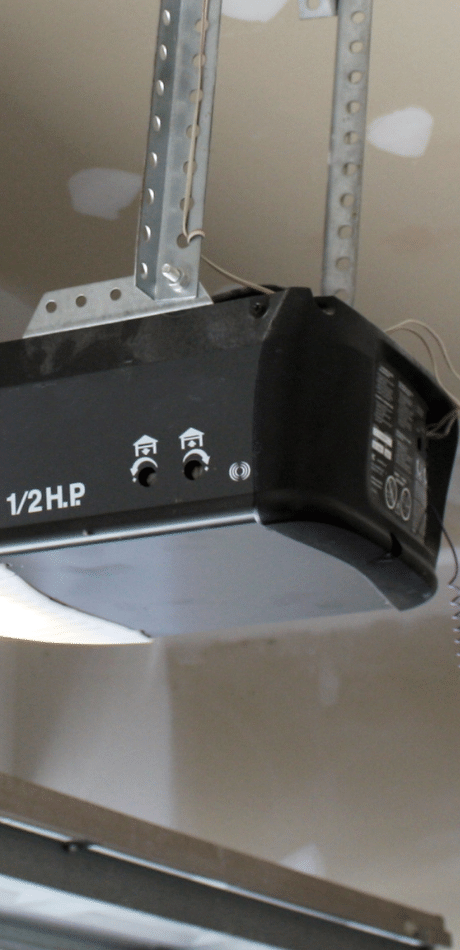 1/2 H.P. garage door opener motor mounted on ceiling brackets