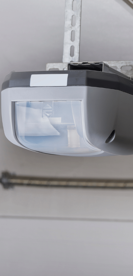 Garage door opener light unit mounted on the ceiling